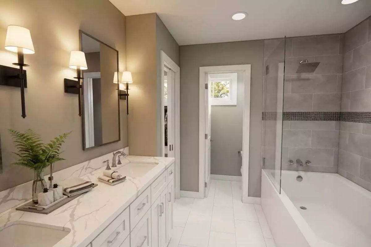 Marble Vanity Top and Glass-Enclosed Tub Shower Split the Work Beautifully