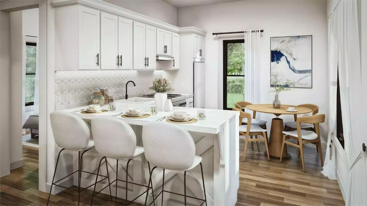 Soft White Kitchen Where the Peninsula Bar Does Double Duty