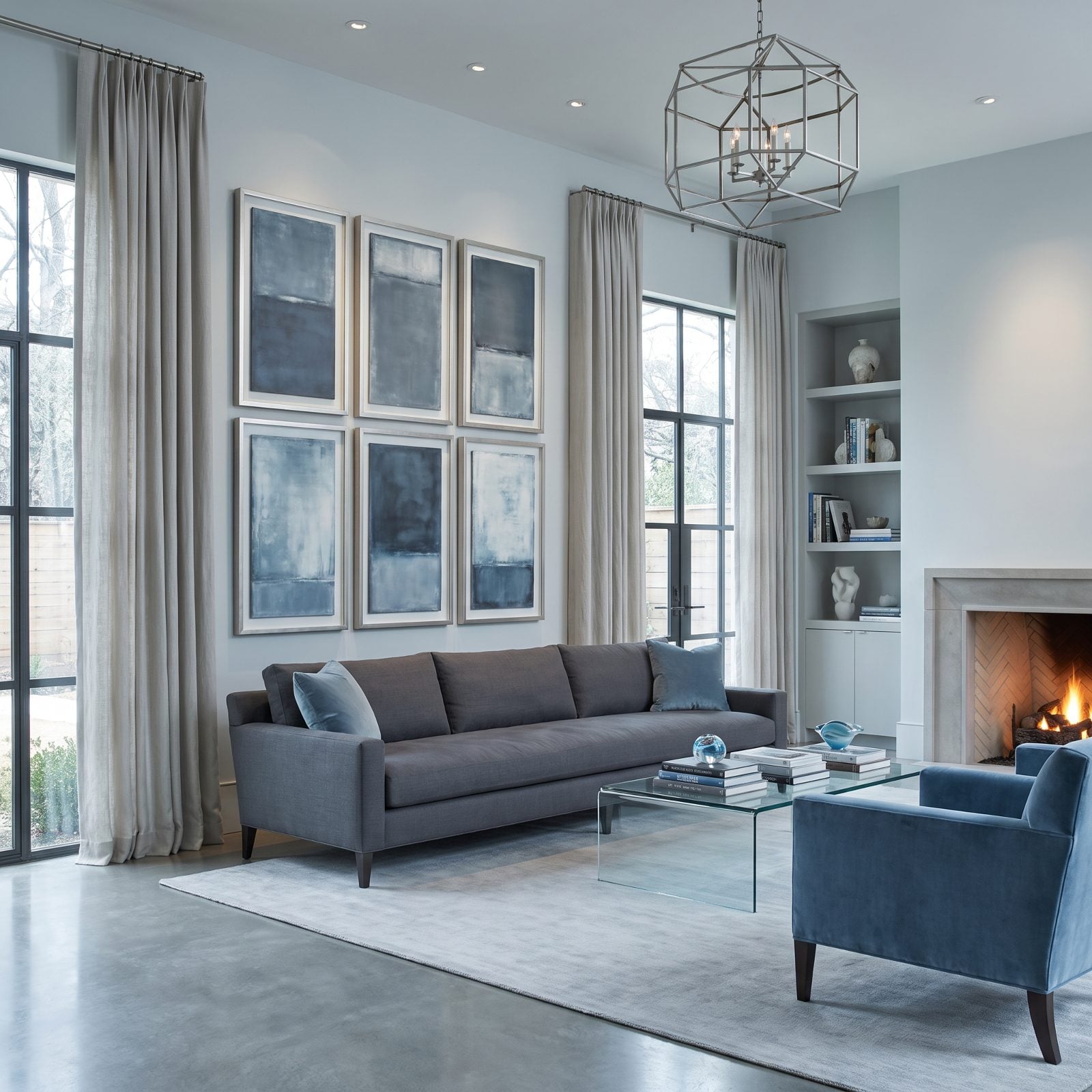 A Gray Sofa Surrounded by Cool Abstract Art