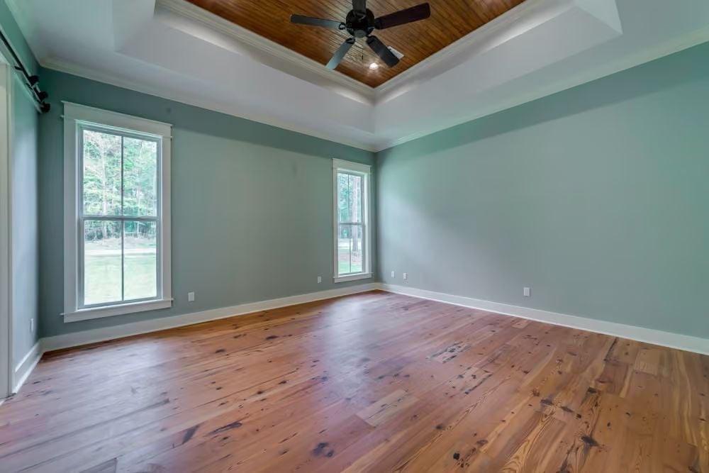 Coffered Wood Ceiling and Reclaimed Pine Floors in the Primary Suite