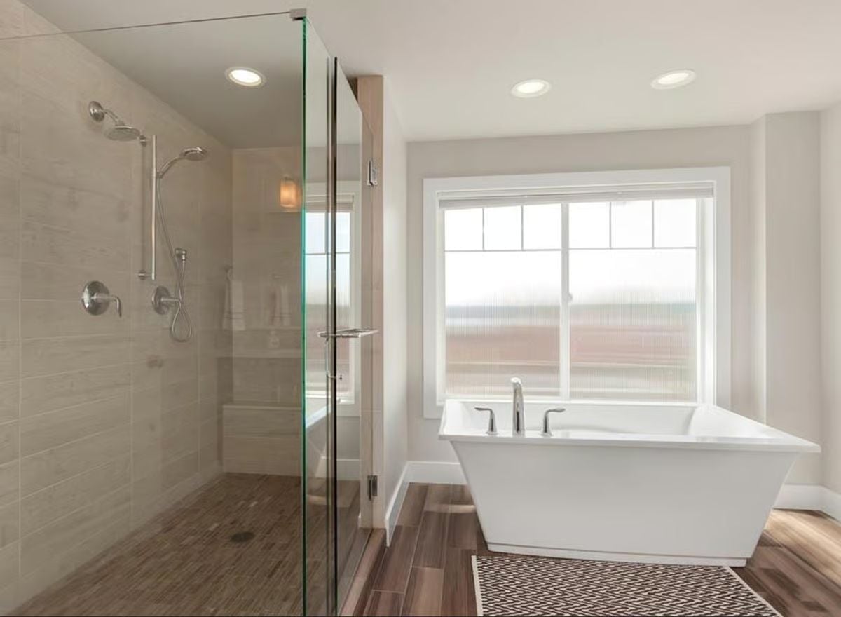 Frameless Glass Shower, Double Rain Heads, and a Soaking Tub That Won't Apologize