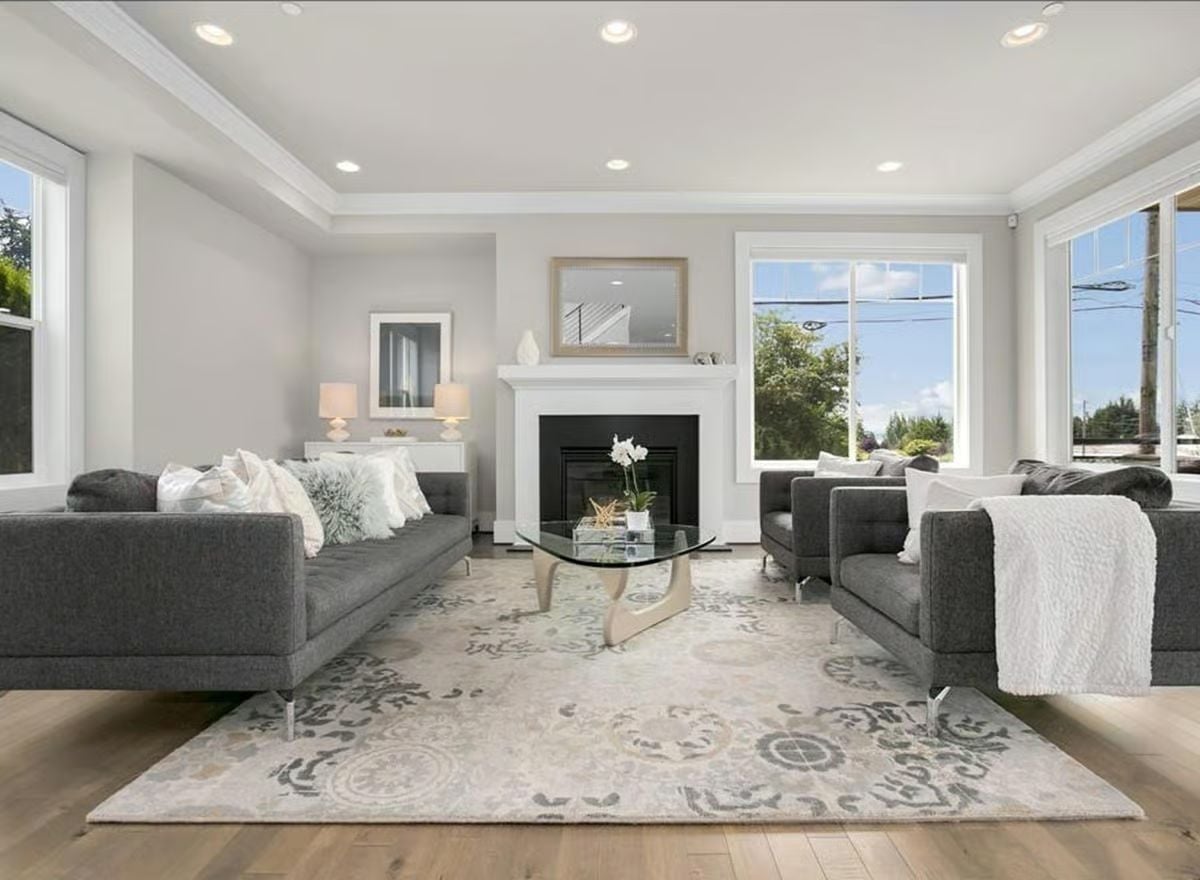 Matched Gray Sofas and a Glass Coffee Table That Earns Its Place