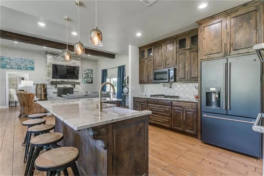 Dark Walnut Cabinets, Marble Island, and a Fridge That Thinks It's in Charge