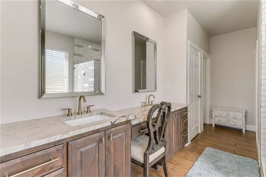 Marble Counters, Brass Faucets, and a Vanity Chair That Means Business