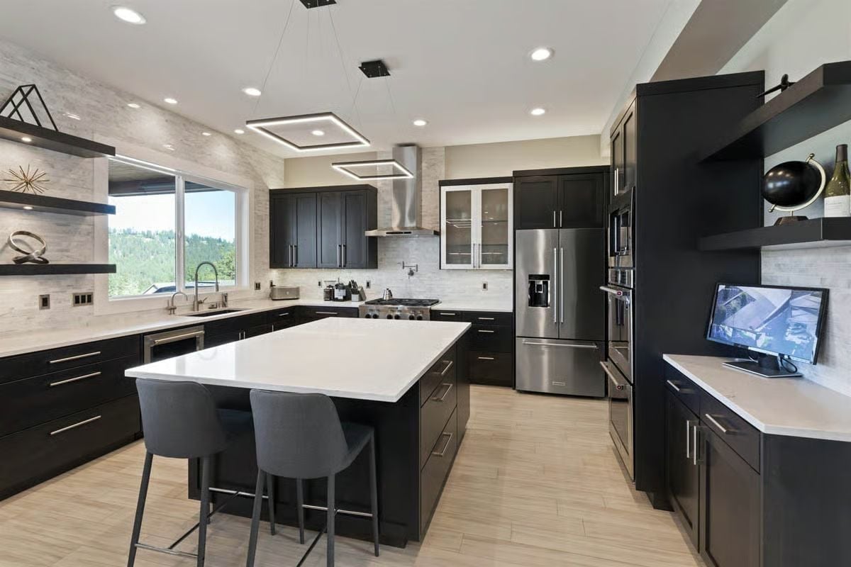 Black Cabinets, White Island, and a Range Hood That Actually Earns Its Footprint