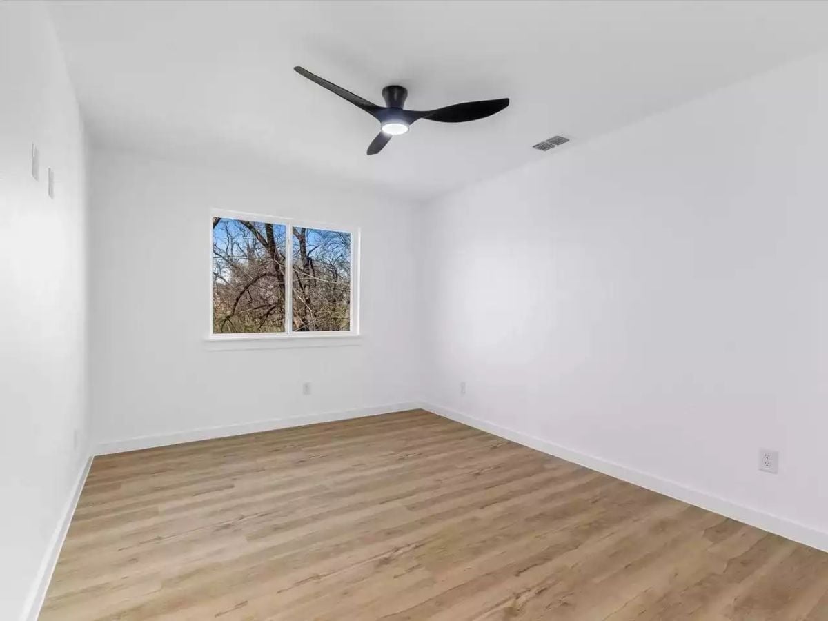 Bare Walls and a Black Ceiling Fan Prove Restraint Has a Point of View