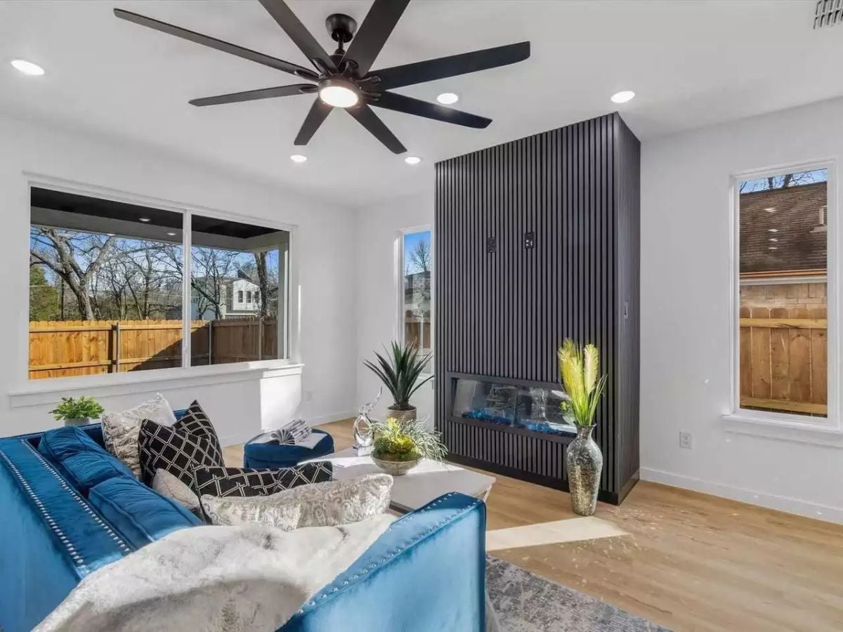 Black Slat Fireplace Wall That Actually Earns the Attention It Demands