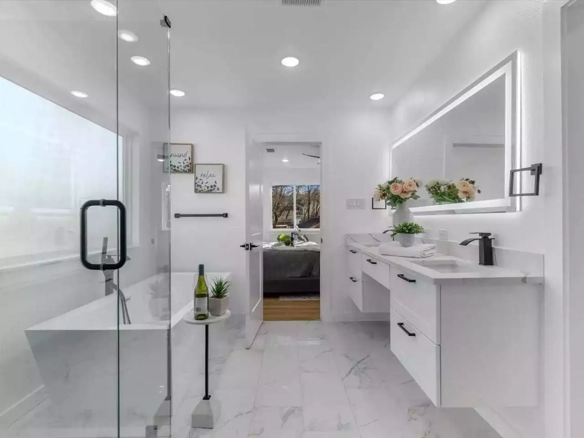 Floating Vanity, Freestanding Tub, and a Wine Bottle That Walked In Uninvited
