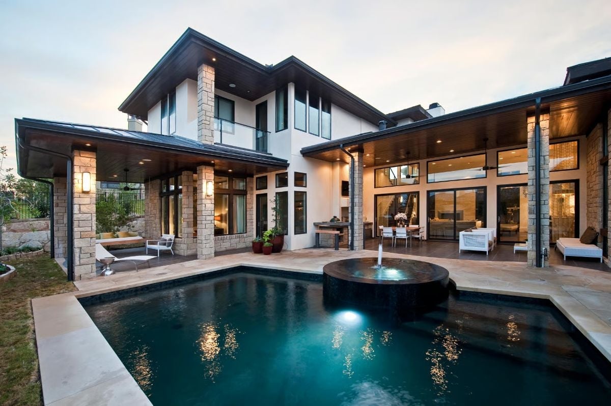 Circular Spa, Glowing Pool, Stone Columns That Mean Business
