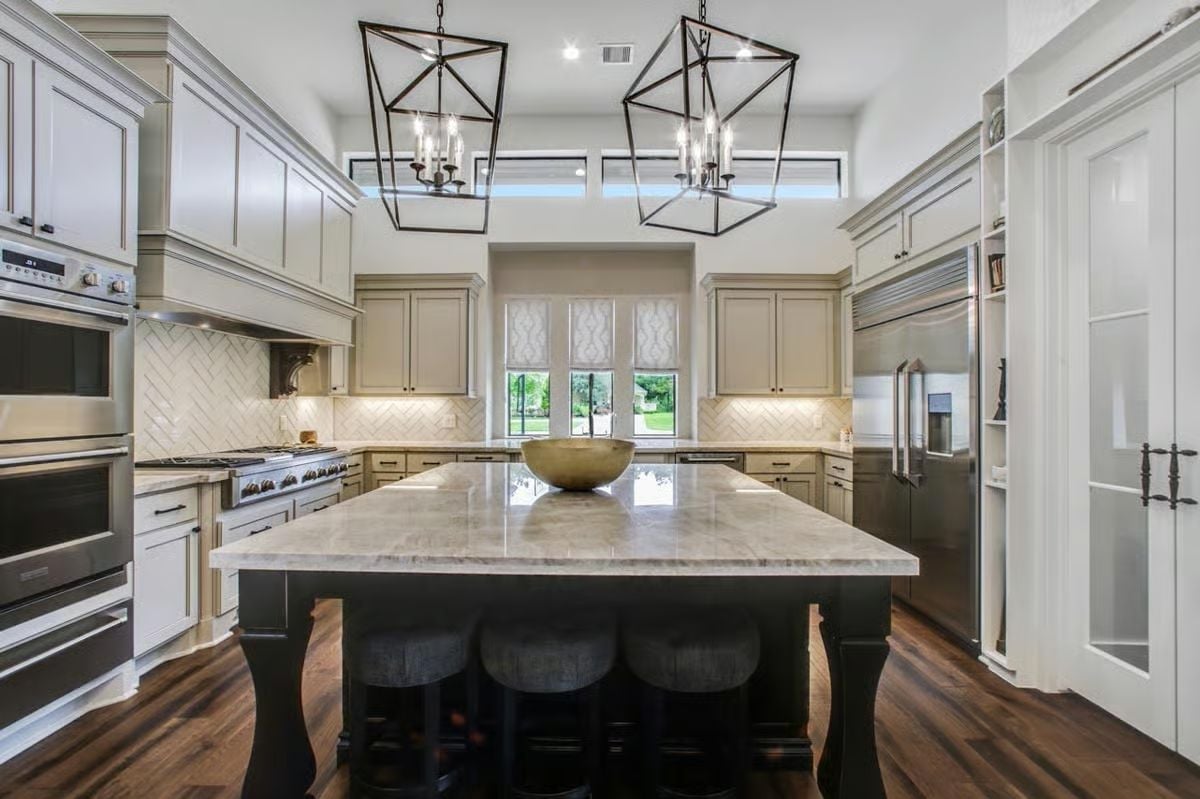 Geometric Pendants, Marble Island, and a Kitchen That Earns Every Compliment
