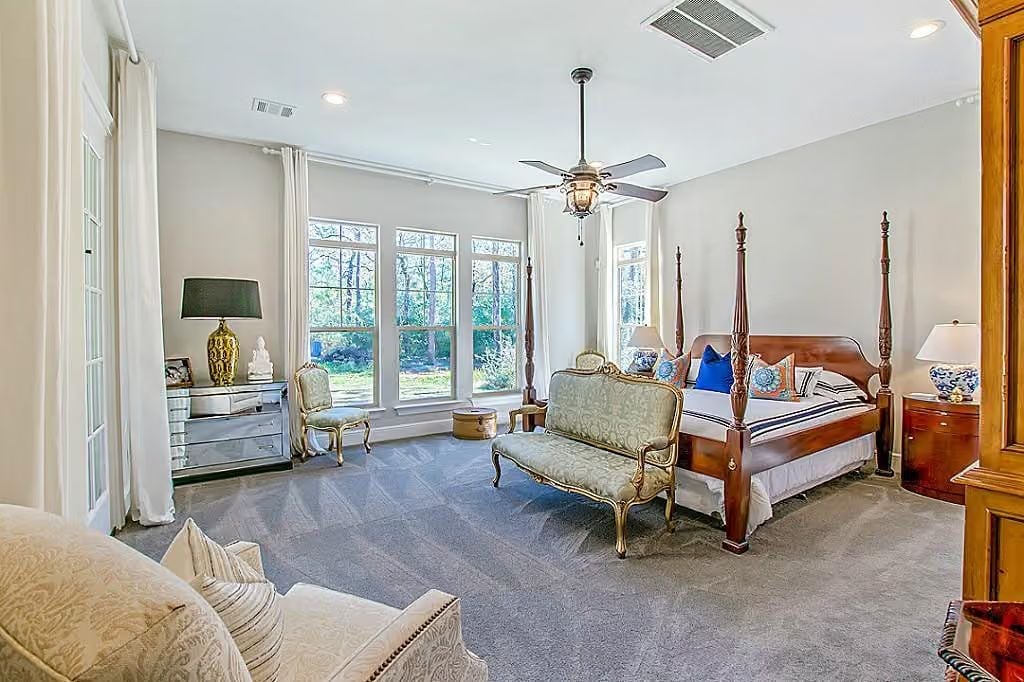 Four-Poster Bed and Gilded Settee Pull Off Old-World Grandeur Without Feeling Stiff