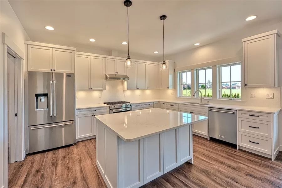 Quartz Island and Stainless Appliances Set a Serious Tone in This Family Kitchen