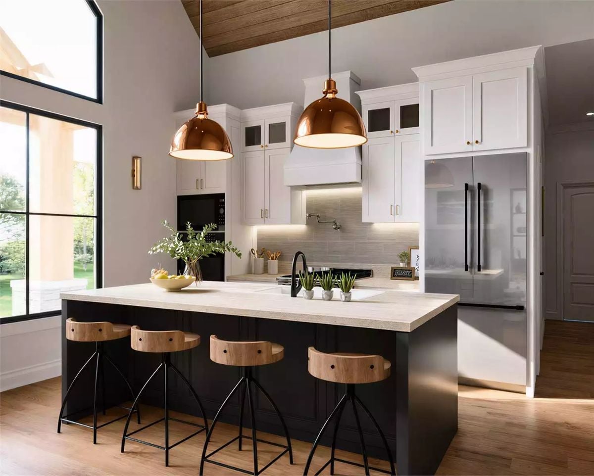 Copper Pendants and a Dark Island Base Anchor This Kitchen Without Competing