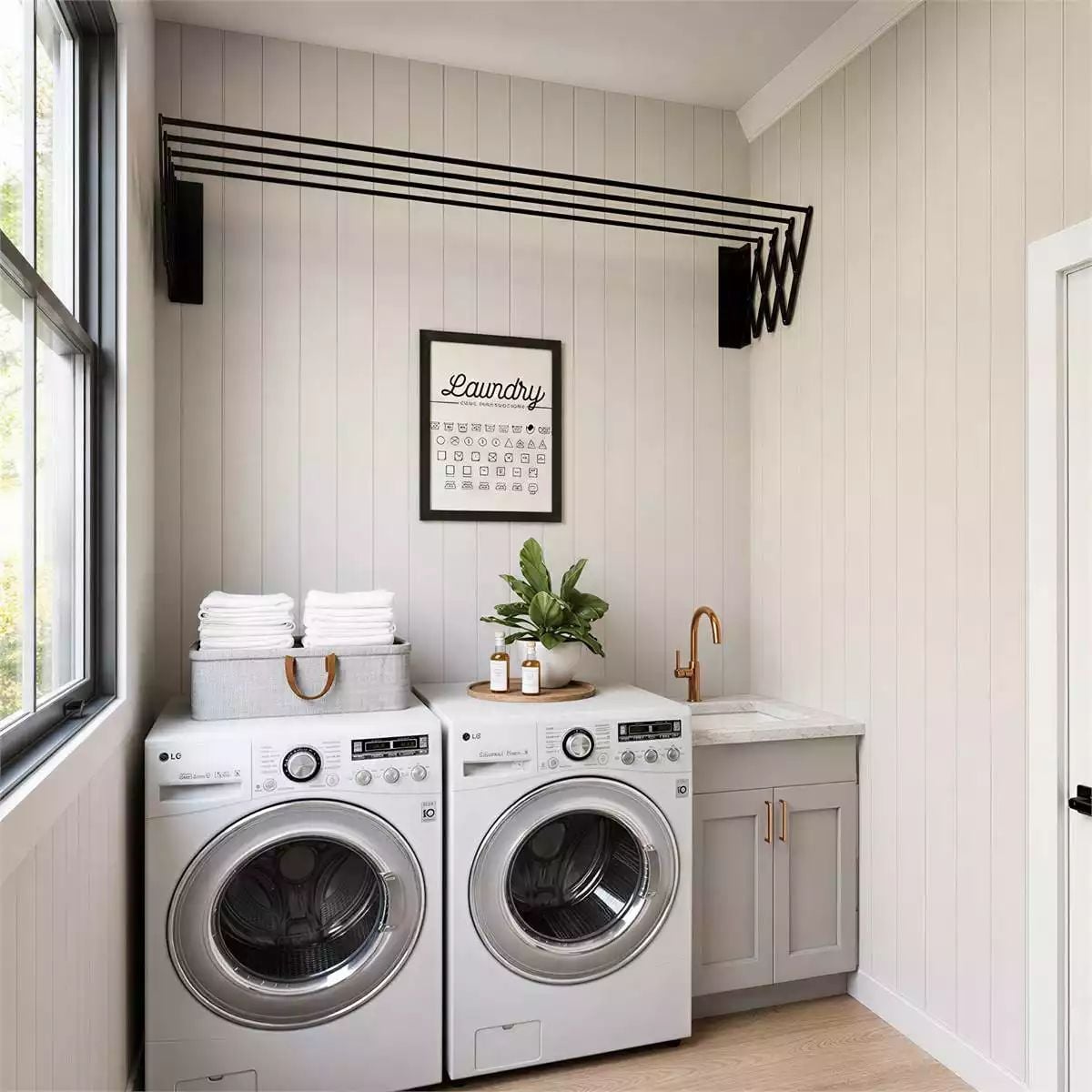 Wall-Mounted Drying Rack and a Gold Faucet Make Laundry Feel Less Like a Chore