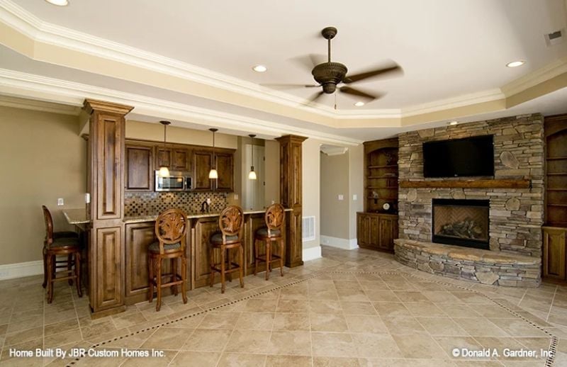 Stacked Stone, Bar Stools, and a Fireplace That Earns Every Square Foot