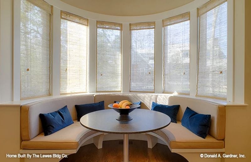 Curved Banquette, Navy Velvet Cushions, and a Bowl of Fruit That Earns Its Place
