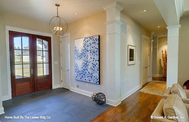 Orb Chandelier, Blue Canvas, and Doors That Earn Their Keep