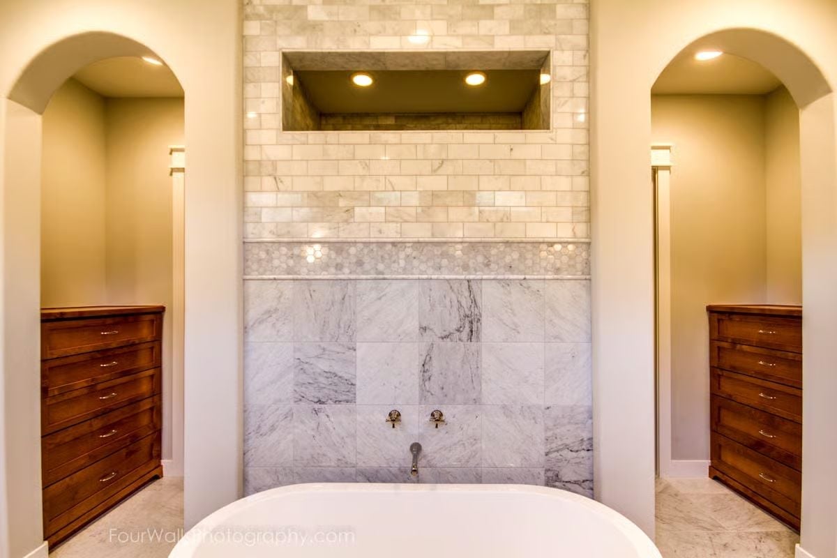 Marble Wall, Soaking Tub, and Twin Niches That Make Symmetry Feel Earned