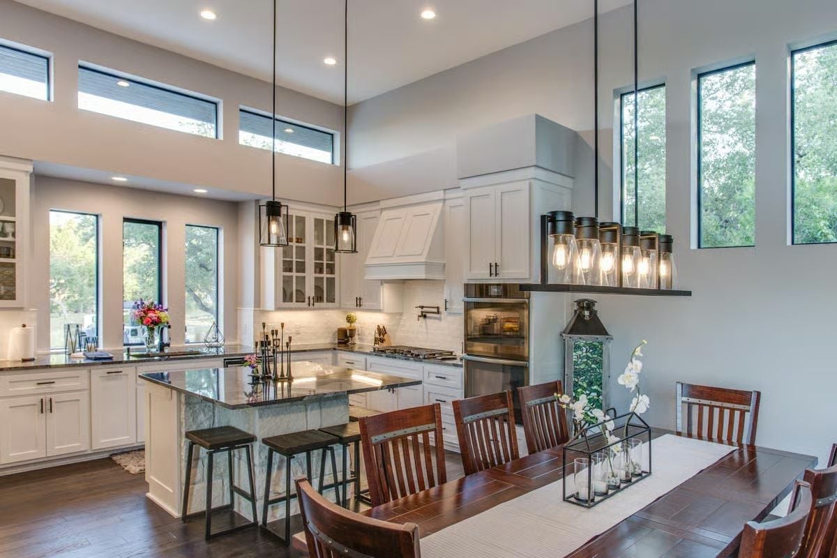 Clerestory Windows and a Marble Island Anchor This Open Kitchen-Dining Space