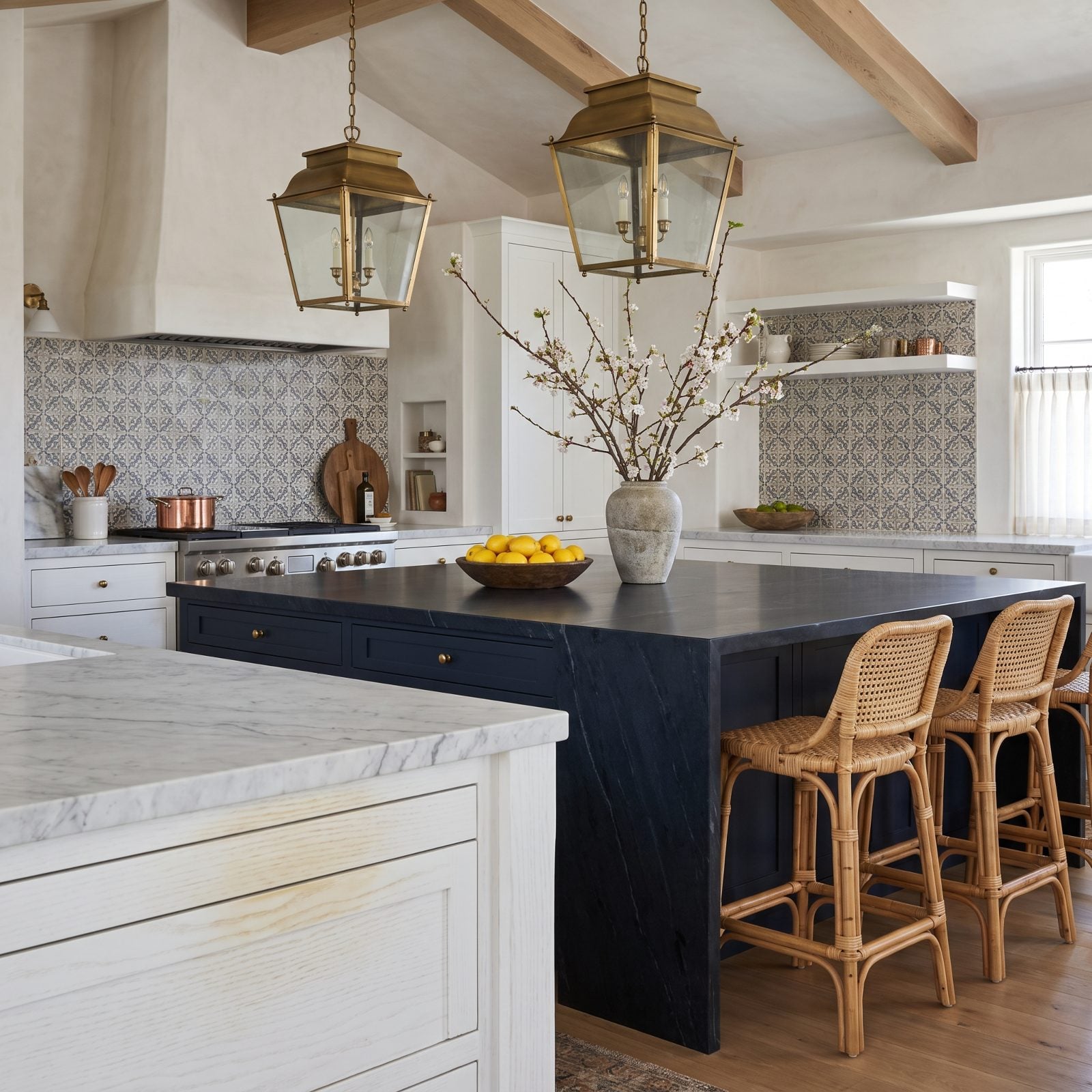White-painted oak cabinets with faint yellow-brown tannin stains bleeding through around the grain.
