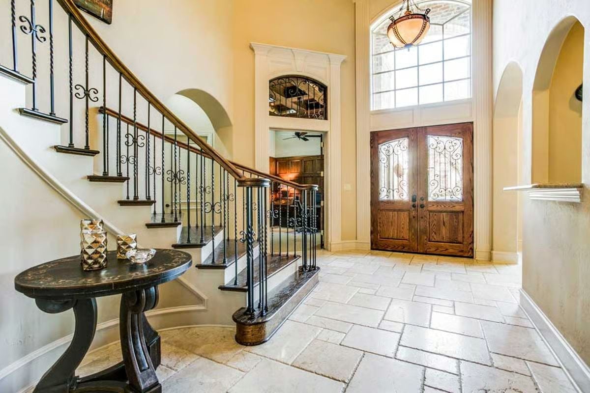 Wrought Iron Balusters and Double Doors That Mean Business
