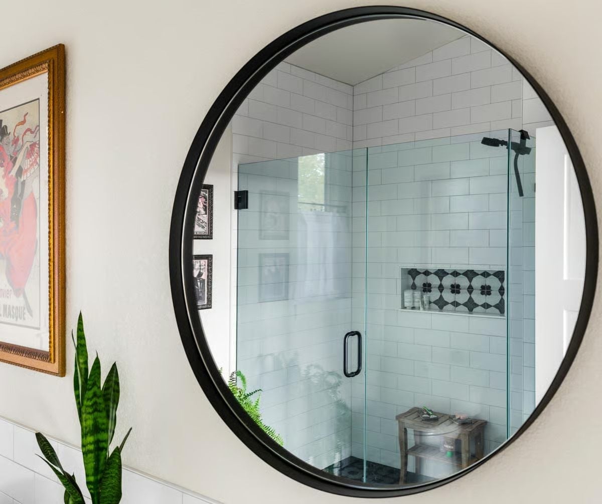 Round Mirror, Patterned Niche, and a Glass Shower That Earns Its Square Footage
