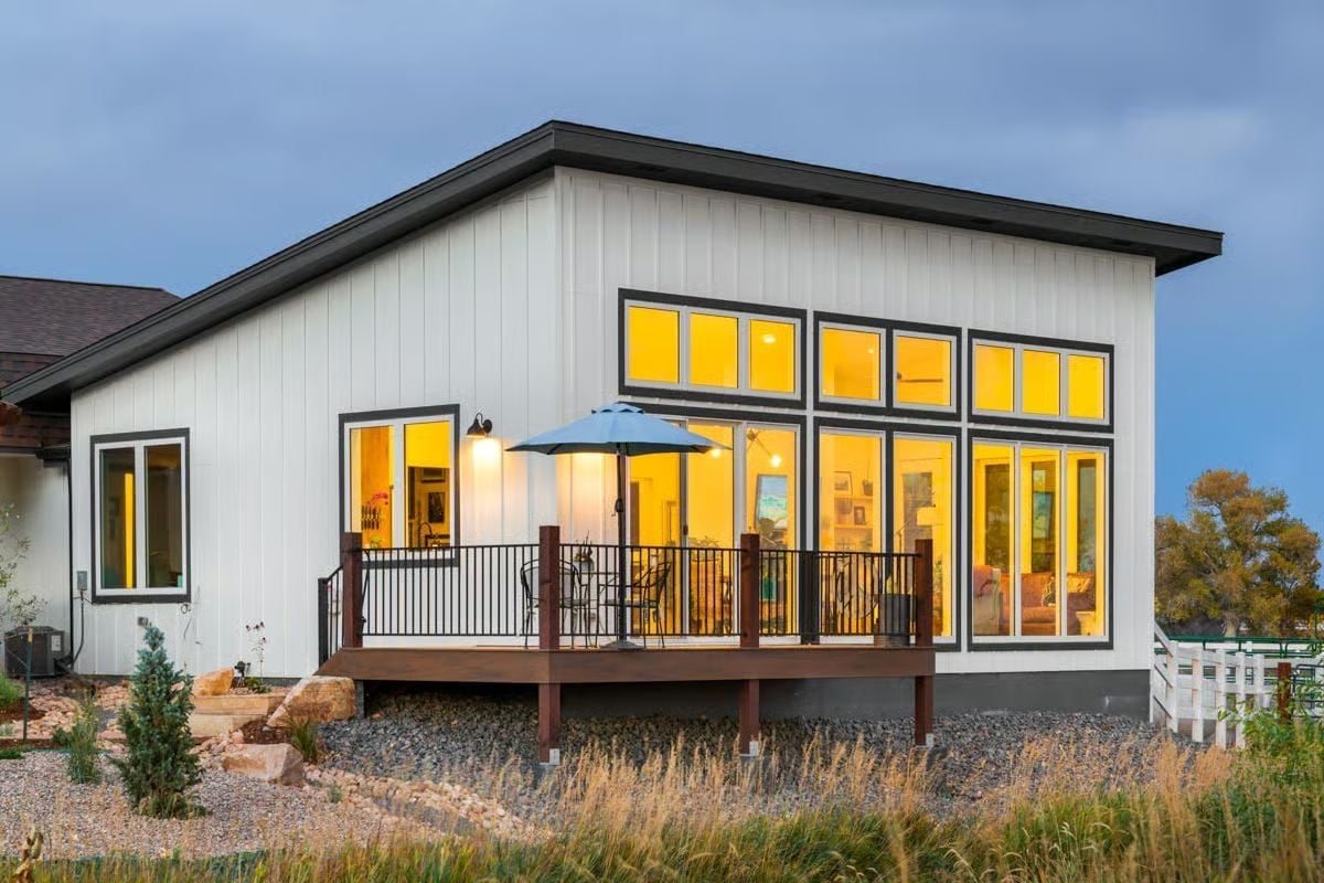 Warm Light Spills Through Clerestory Windows Onto a Cedar Deck Built for Two