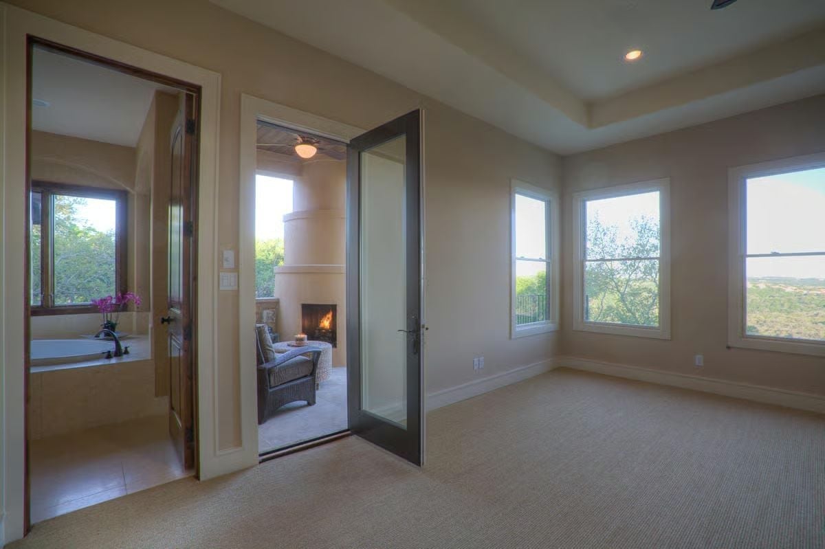 Carpet, Glass Door, and a Fireplace You Can See From Two Rooms Away