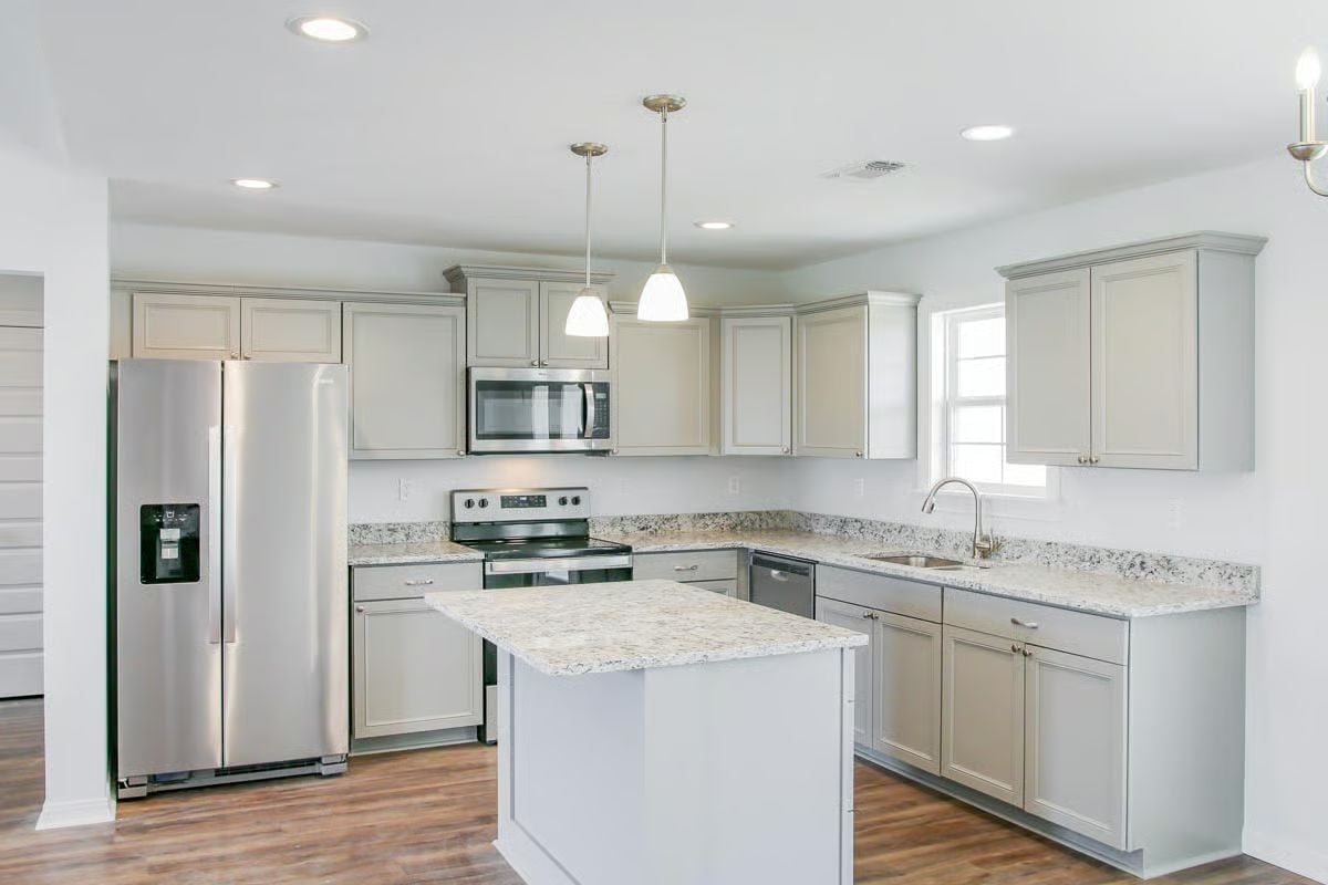 Granite Counters, Gray Cabinets, and Stainless Steel That Actually Earns Its Place