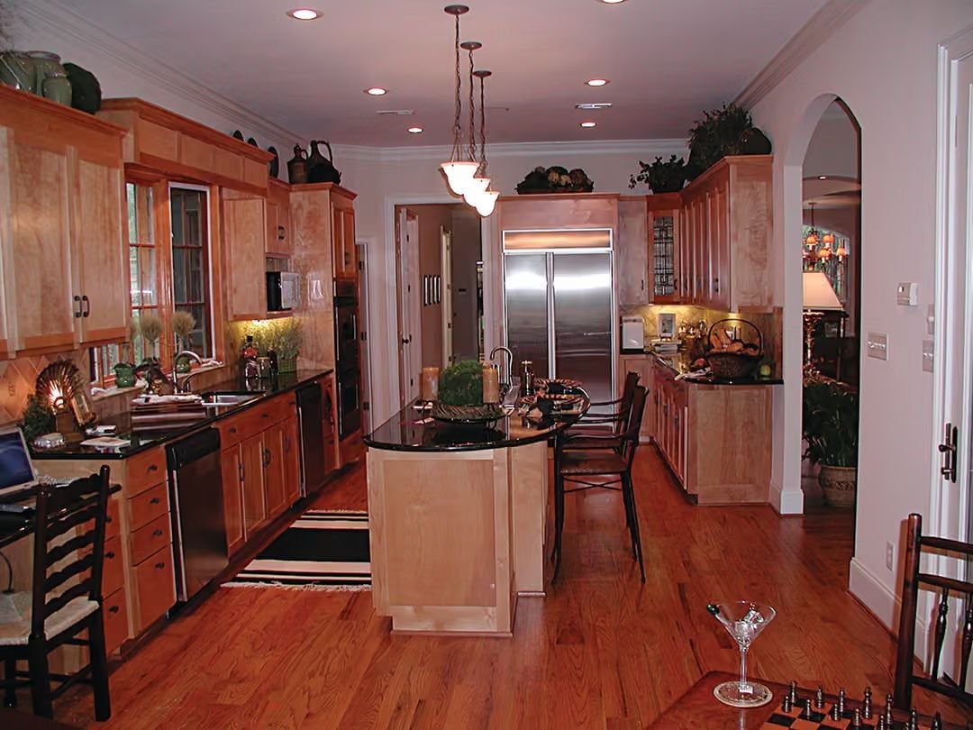 Black Granite Island, Warm Maple Cabinets, and a Kitchen Built to Actually Cook In