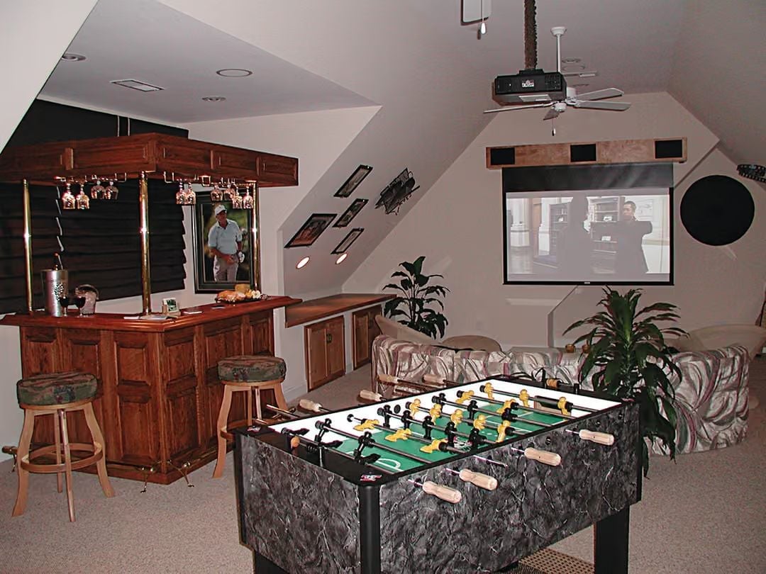 Foosball, a Projector Screen, and a Bar Setup That Makes the Loft Worth the Stairs
