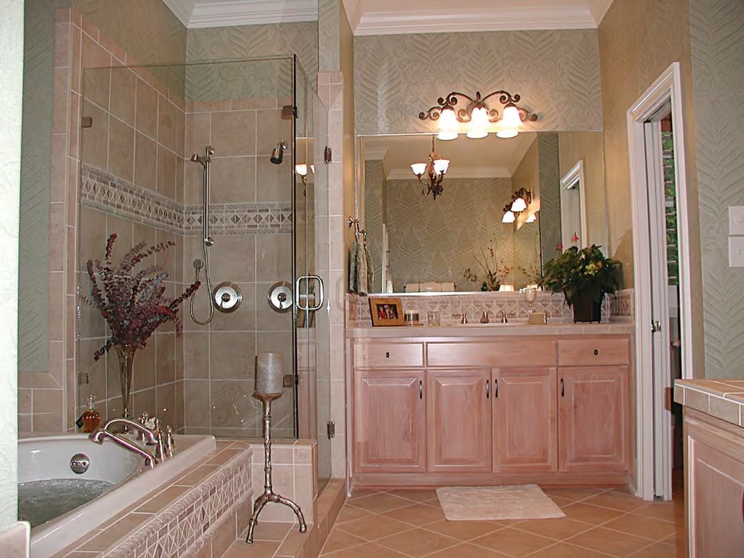 Wrought Iron Vanity Lights and a Glass Shower Enclosure Worth Every Penny
