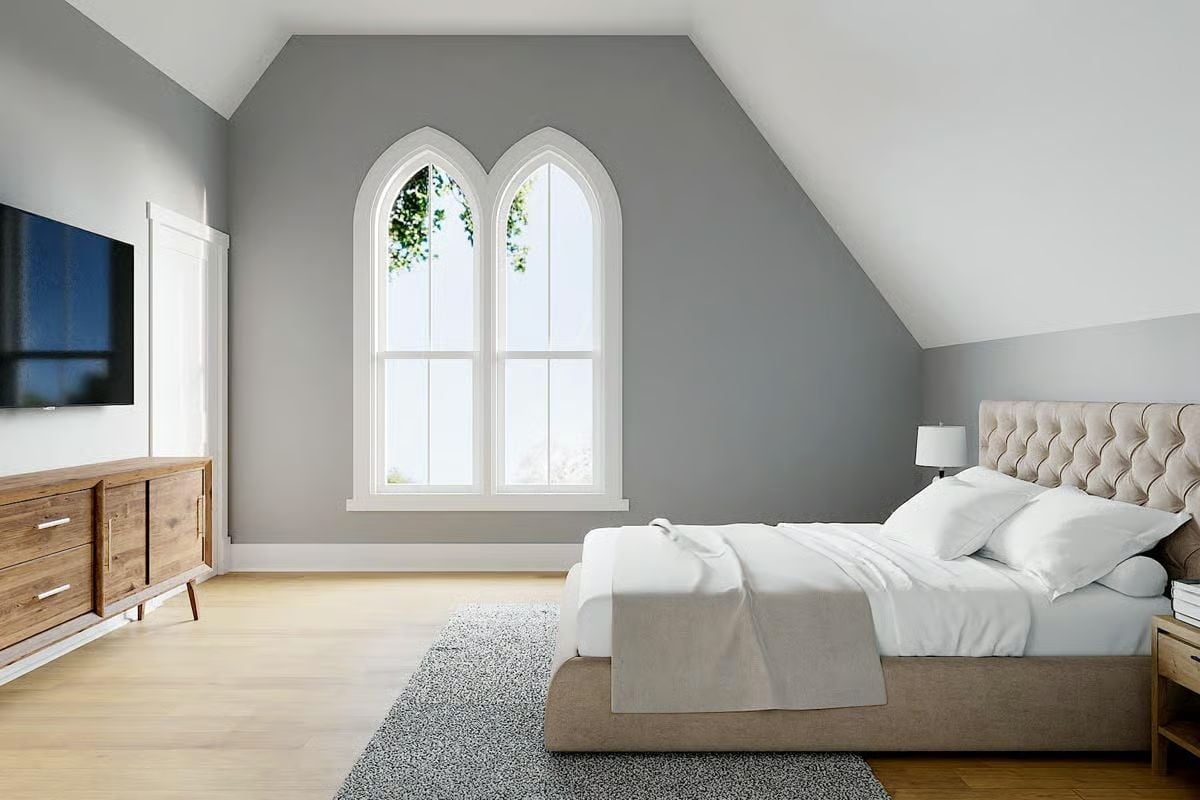 Gothic Arched Windows and a Tufted Headboard That Don't Apologize for Each Other