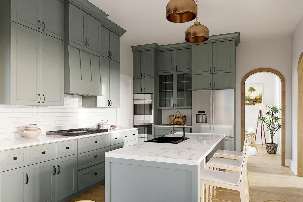 Sage Cabinets, Copper Pendants, and a Marble Island That Pulls It Together