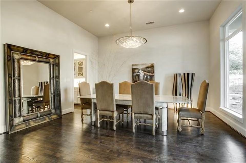 Oversized Leaning Mirror and Crystal Pendant Make This Dining Room Feel Collected, Not Decorated