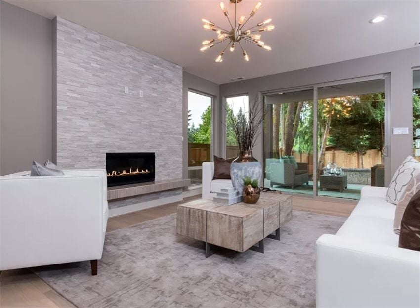 Stacked Stone Fireplace Wall That Goes Floor to Ceiling Without Apology