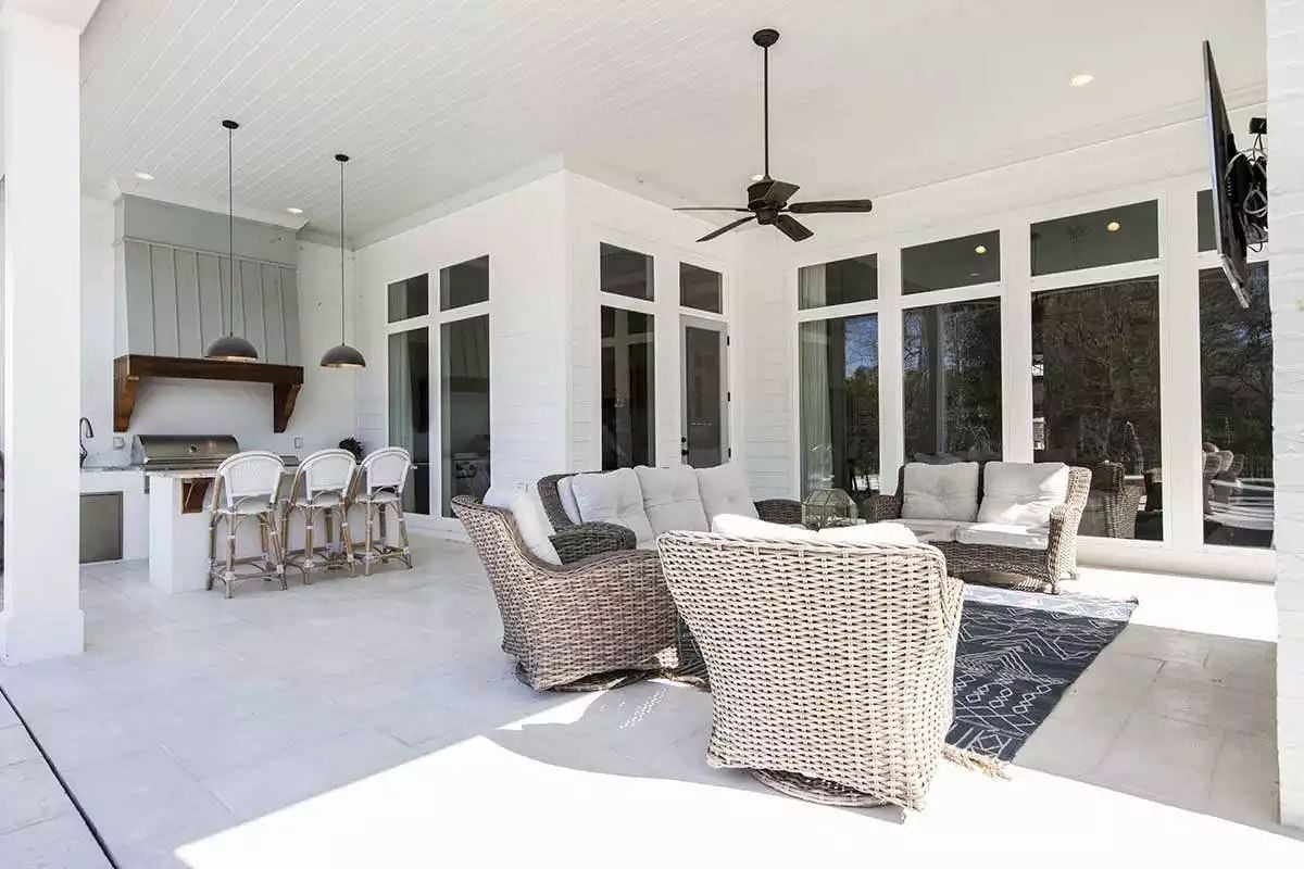 Wicker Swivel Chairs, an Outdoor Kitchen, and a Ceiling Fan That Pulls It All Together