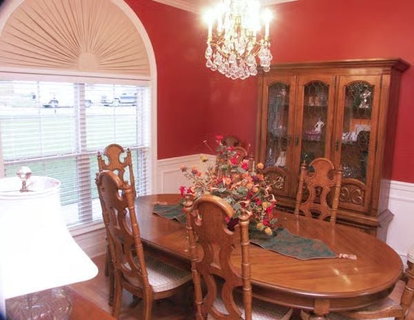 Crystal Chandelier, Red Walls, and a China Cabinet That Means Business