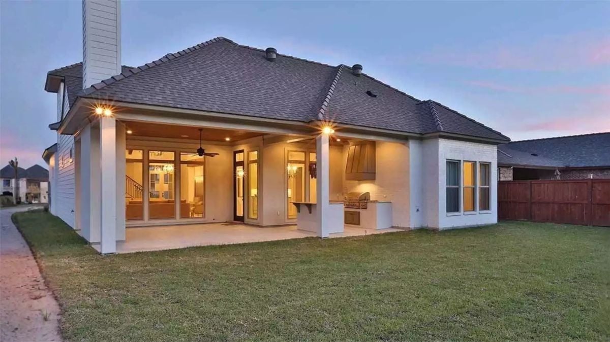 Covered Rear Porch With Outdoor Kitchen Built for Long Summer Evenings