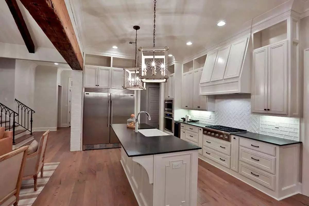 Dark Countertops Against Cream Cabinetry Keep This Kitchen From Looking Like Every Other White Kitchen