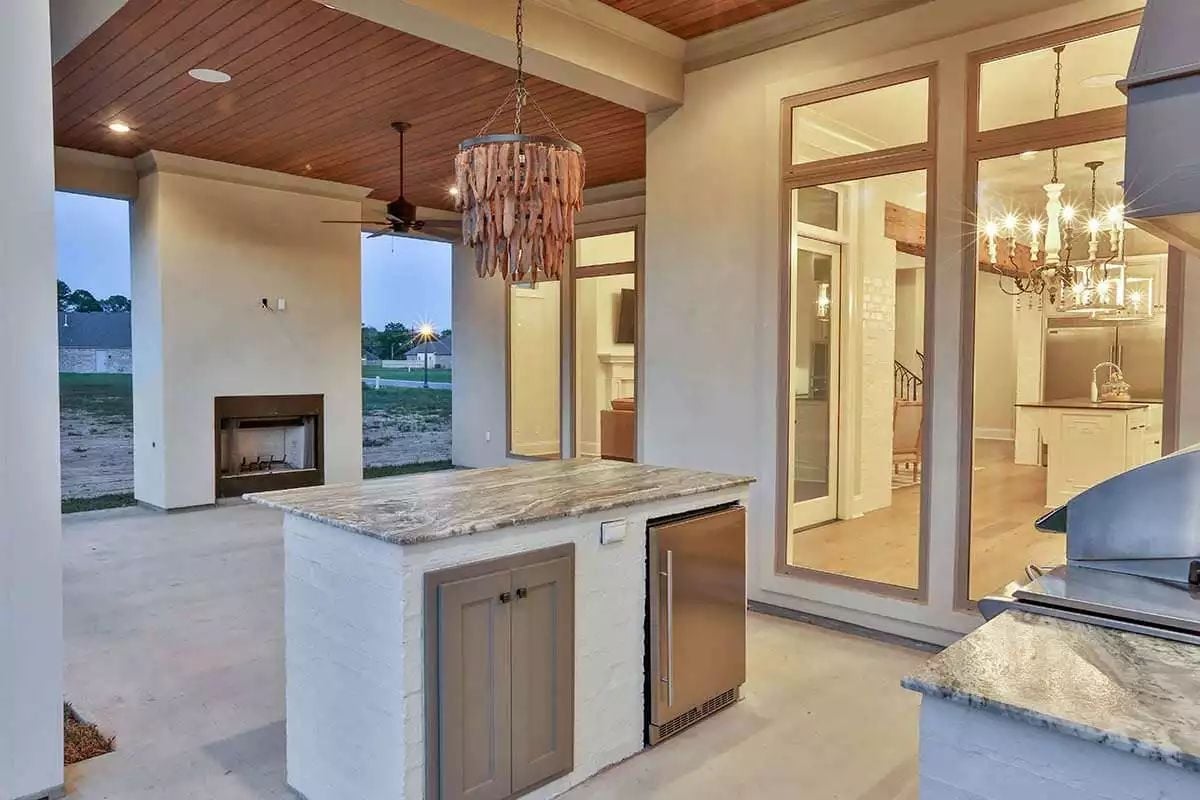 Driftwood Chandelier and a Built-In Kegerator Make This Outdoor Kitchen Worth Staying Home For