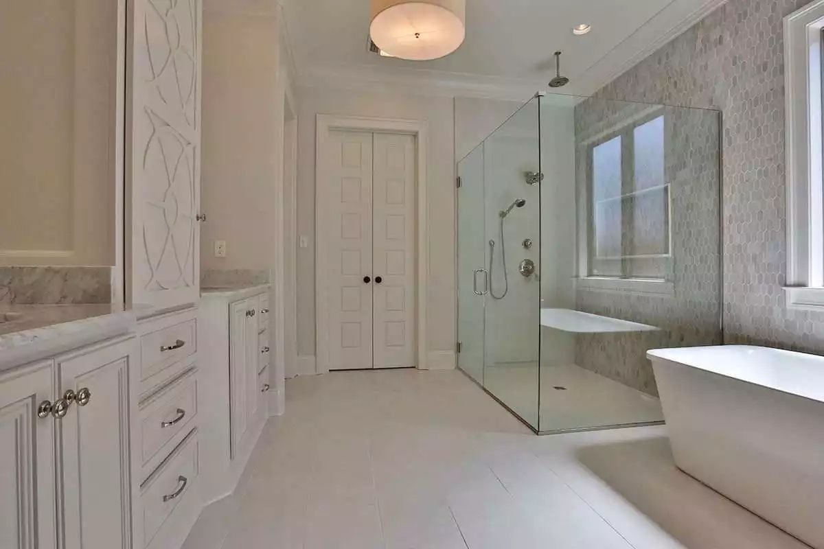 Marble Hex Tile and a Frameless Glass Enclosure Make This Bathroom Feel Like a Spa Retreat You Don't Have to Leave