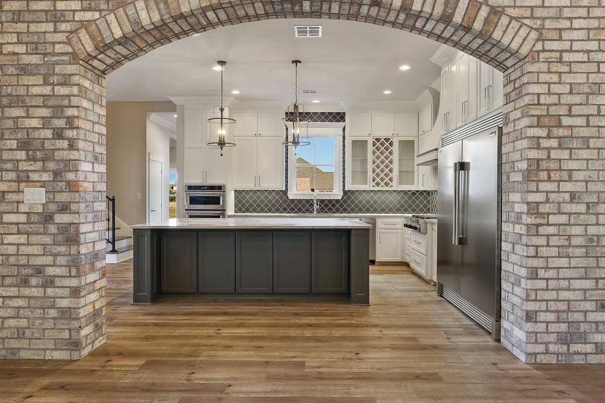 Brick Archway That Frames the Kitchen Like Architecture Should