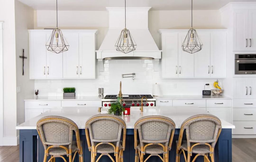 Geometric Pendants and a Red Range Make the White Kitchen Worth Remembering