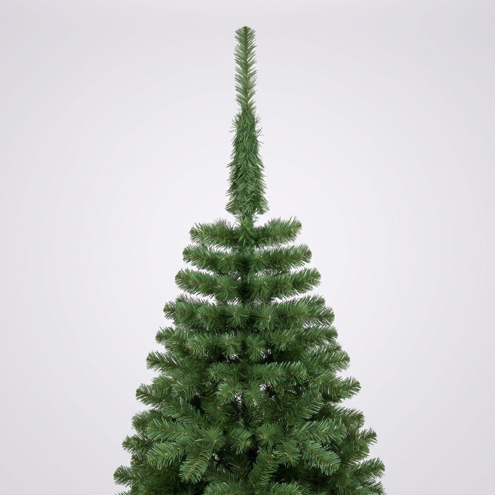 Tall artificial tree with a thin, sparse, unfluffed top section revealing the metal pole below a crooked star topper.