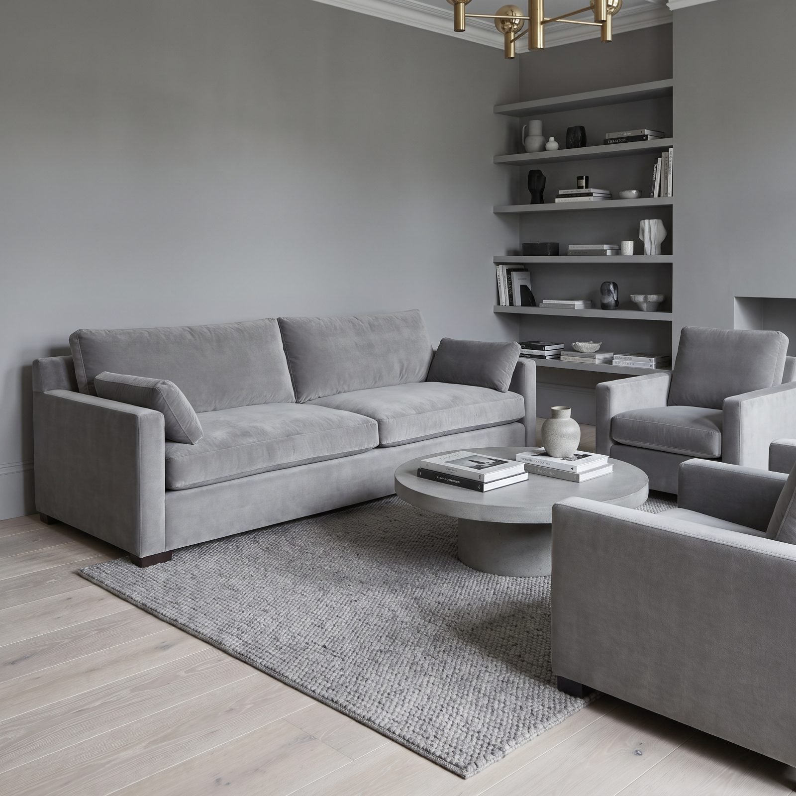 A Light Gray Sofa Disappearing Against Gray Walls