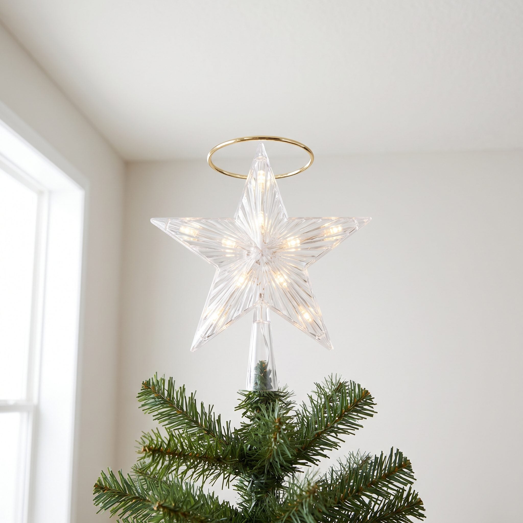 A Light-Up Star or Angel Crowning the Tree