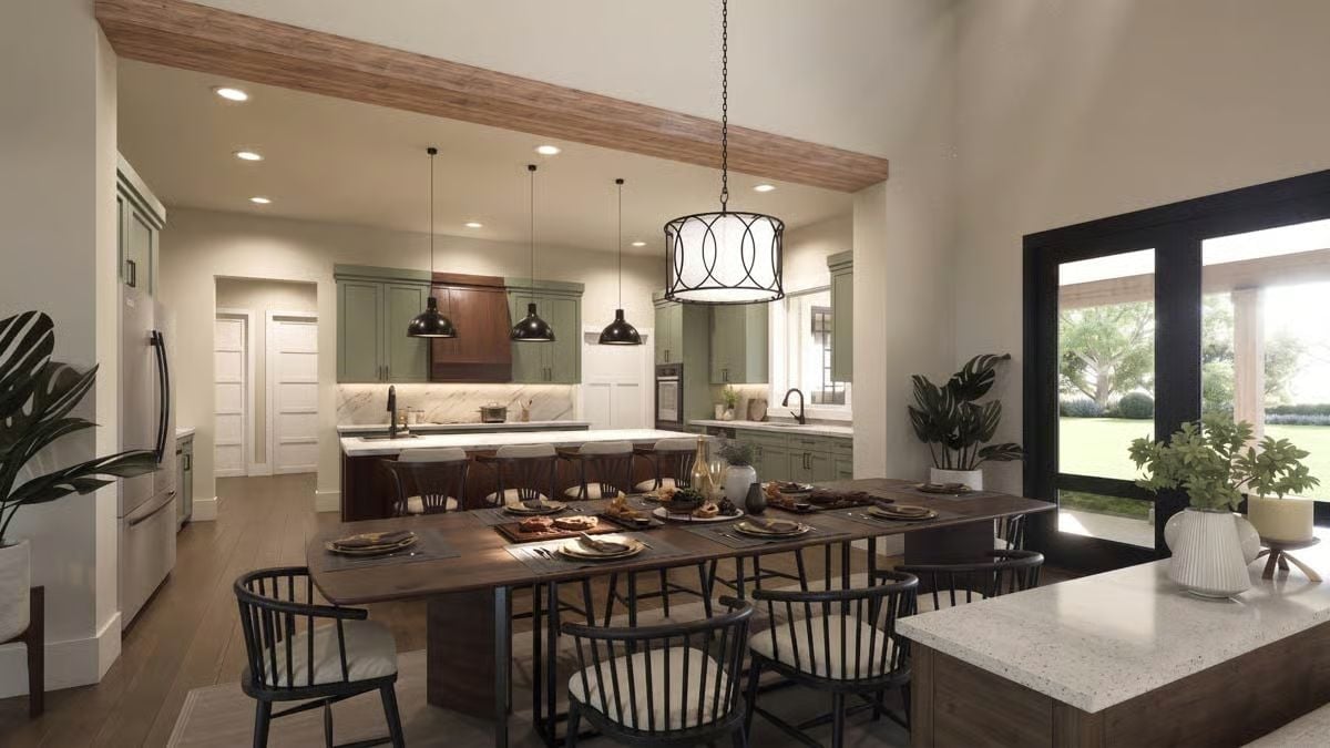 Sage Cabinets Earned Their Place, But That Table Is the Real Anchor