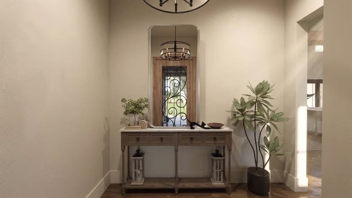 Wrought Iron, Warm Wood, and a Mirror That Makes the Entryway Feel Twice as Deep