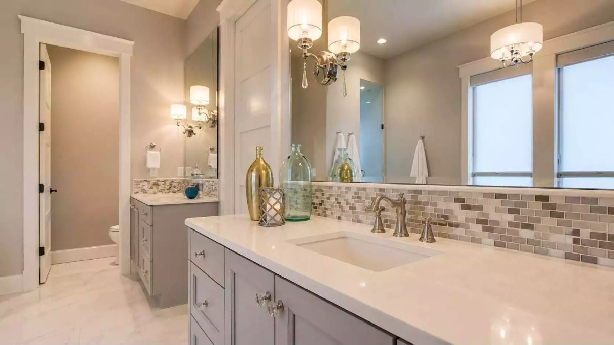 Gold Vessels and Mosaic Tile Give This Double Vanity Serious Visual Weight